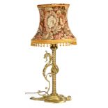 A LATE 19TH CENTURY GOTHIC STYLE BRASS TABLE LAMP with barley twist stem and scroll mounted