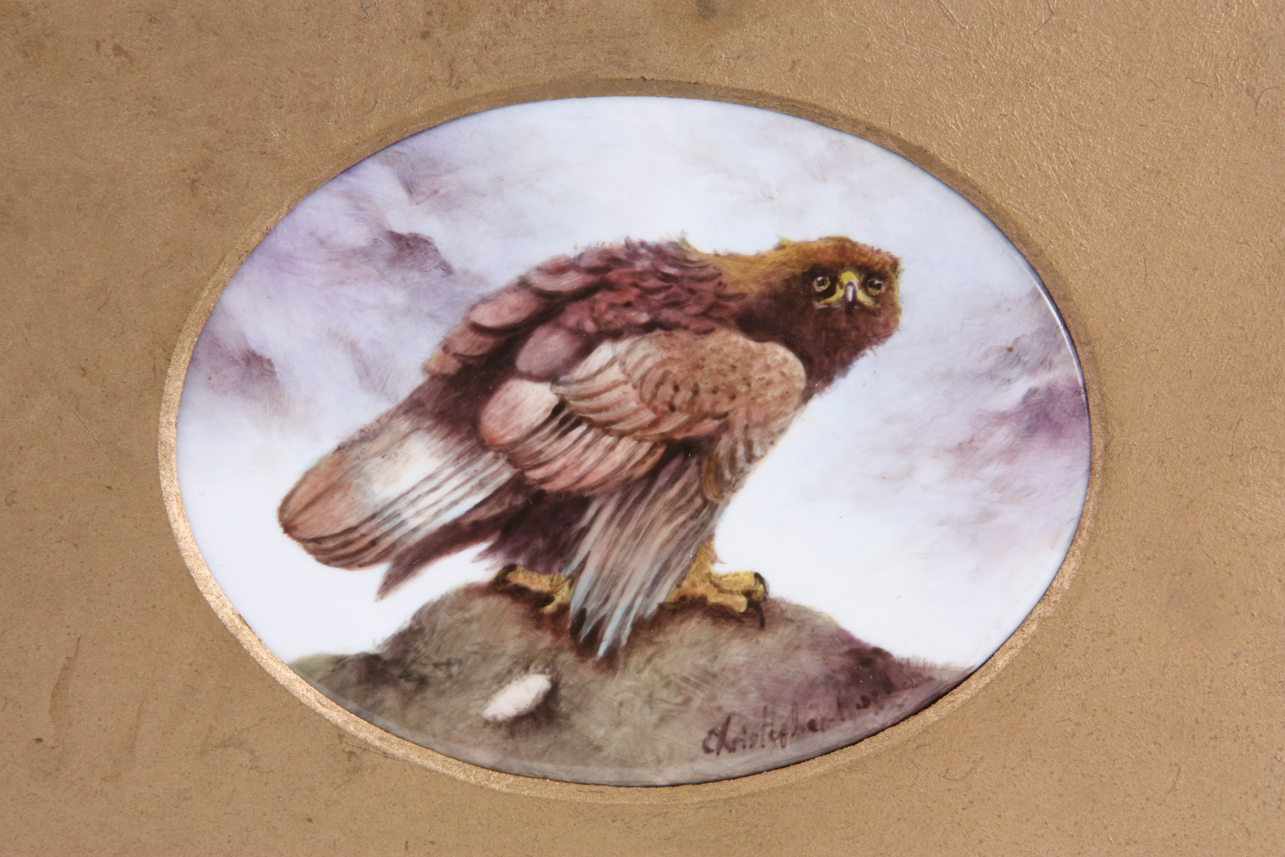 A HAND PAINTED OVAL PORCELAIN PLAQUE OF A GOLDEN EAGLE - framed and mounted 9cm high 12cm wide. - Image 2 of 3