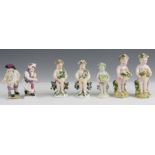 A SELECTION OF SEVEN SMALL PORCELAIN FIGURES including a pair of Berlin figures, three Derby Putti