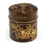 A MEIJI PERIOD JAPANESE PATINATED BRONZE CYLINDRICAL POT AND COVER with applied gilt decoration