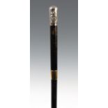 A LATE 19TH CENTURY EBONISED SWORD/SWAGGER STICK WITH SILVER POMEL having a four sectional steel