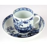 AN 18TH CENTURY BLUE AND WHITE LOWESTOFT COFFEE CUP & SAUCER decorated in oriental scenes.