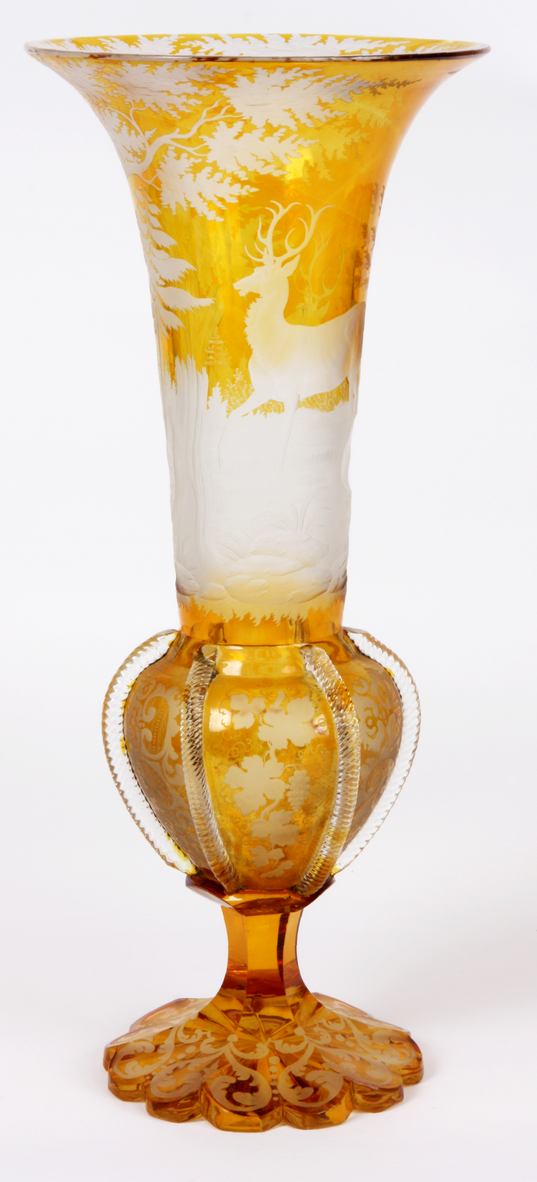 AN EARLY 20TH CENTURY AMBER COLOURED SLENDER SHAPED BOHEMIAN GLASS VASE with finely engraved