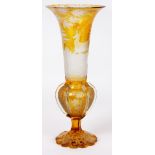 AN EARLY 20TH CENTURY AMBER COLOURED SLENDER SHAPED BOHEMIAN GLASS VASE with finely engraved