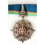 A SOUTHEAST ASIA SILVER AND ENAMEL MILITARY MEDAL