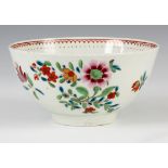 AN 18TH CENTURY POLYCHROME FIRST PERIOD WORCESTER BOWL decorated with flowers 6.5cm high 12cm