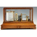 AN EARLY 20th CENTURY OAK CASED BAROGRAPH having glazed lift off lid on plinth base with chart