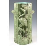 A LATE 19th CENTURY ENGLISH MAJOLICA UMBRELLA STAND flamingo pattern in pale green 60cm high.