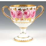 A LATE 19TH CENTURY CAULDON ROSE PATTERN PORCELAIN LOVING CUP decorated with gilt work and pink