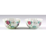 A PAIR OF 19TH CENTURY CHINESE RIBBED TEA BOWLS decorated with floral decoration 4.5cm high 8.5cm
