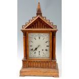 A LATE 19th CENTURY OAK CASED EIGHT BELL QUARTER CHIMING BRACKET CLOCK the gothic style case with