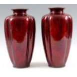 A LARGE PAIR OF EARLY 20TH CENTURY JAPANESE RED ENAMEL AND SILVER FOIL VASES decorated with cranes