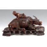 A 19TH CENTURY CARVED HARDWOOD CHINESE SCULPTURE OF A SEATED WATER BUFFALO finely carved with