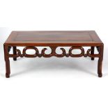 A 19TH CENTURY CHINESE HARDWOOD LOW OCCASIONAL TABLE with scroll cut-out frieze on branch legs 76.