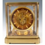 A 1950’s JAEGER-LECOULTRE ATMOS CLOCK the glazed gilt case enclosing a skeletonised dial with Arabic