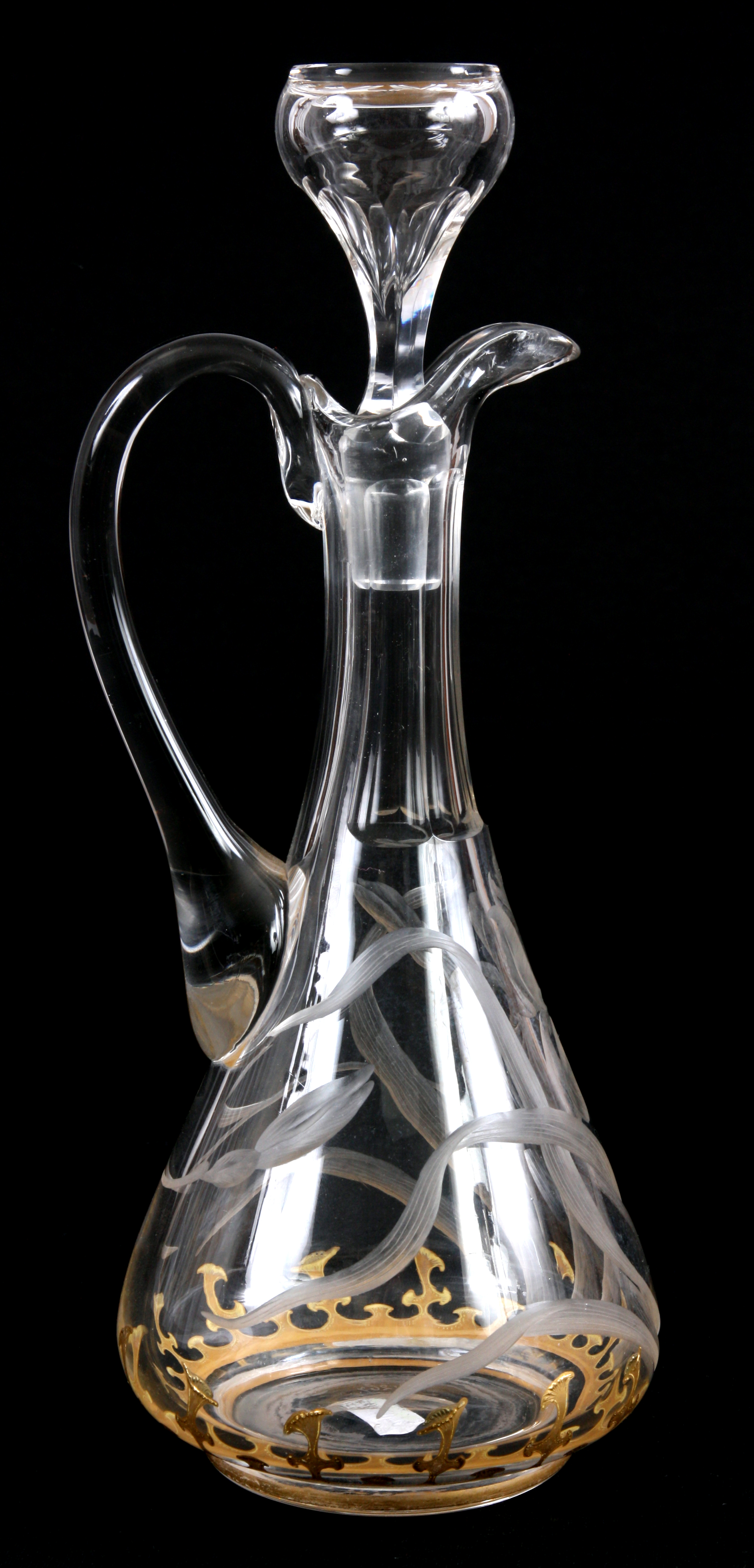 A STYLISH CLEAR GLASS MOSER DECANTER with etched floral and gilt decoration 31.5cm high.