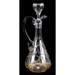 A STYLISH CLEAR GLASS MOSER DECANTER with etched floral and gilt decoration 31.5cm high.