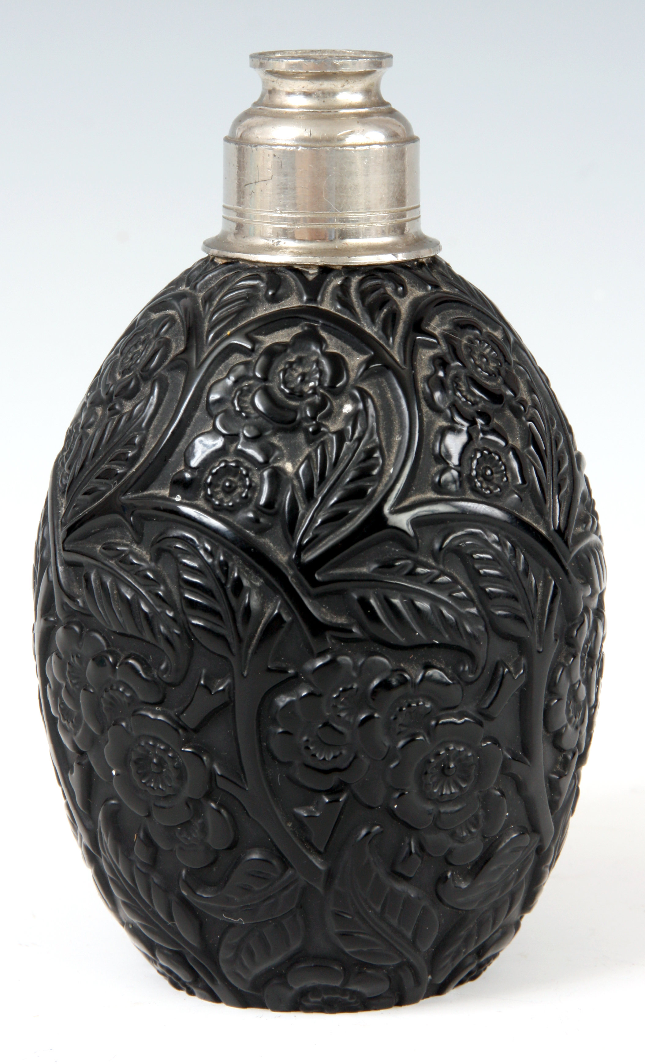 AN UNUSUAL ART DECO BLACK GLASS PERFUME DECANTER engraved with flowerhead and leaf decoration signed