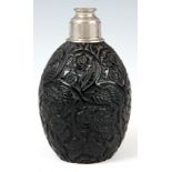 AN UNUSUAL ART DECO BLACK GLASS PERFUME DECANTER engraved with flowerhead and leaf decoration signed