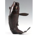 A MEIJI PERIOD JAPANESE PATINATED BRONZE VASE formed as a leaping carp with gilt eye and red flashes