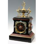 A LATE 19th CENTURY FRENCH MANTEL CLOCK with large ormolu mounted urn finial above a black slate and