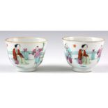 A PAIR OF EARLY 19TH CENTURY / LATE 18TH CENTURY TEA CUPS decorated with figures – signed to the