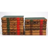 A SET OF 13 LEATHER BOUND ANTIQUE CLOCK BOOKS.