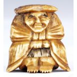 A JAPANESE BONE NETSUKE of an oriental man wearing a hat.