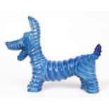 A CARLTONWARE RIBBED PORCELAIN COMICAL DOG with blue glaze and stamped underneath 20cm wide 15.5cm
