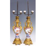 A FINE PAIR OF 19TH CENTURY IMARI AND ORMOLU MOUNTED TABLE LAMPS comprising of a pair of early