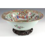 A LARGE 19TH CENTURY CANTON BASIN ON STAND decorated panelled town scenes and floral decoration 12cm