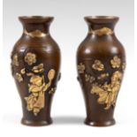 A PAIR OF MEIJI PERIOD JAPANESE PATINATED BRONZE VASES with applied gilt decoration depicting