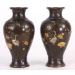 A PAIR OF JAPANESE MEIJI PERIOD PATINATED BRONZE VASES of baluster form with mixed metal cast