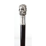 AN EARLY 20th CENTURY SILVER METAL HANDLED WALKING CANE FORMED AS THE FACES OF SIX GREEK GODS,