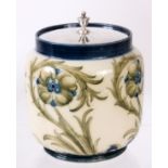 A MOORCROFT MACINTYRE PRESERVE POT having an unusual rare floral decoration, with a silvered