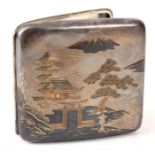 AN EARLY 20th CENTURY JAPANESE SILVER AND MIXED METAL CIGARETTE CASE with costal house scene and