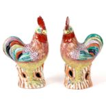 A PAIR OF LATE 19TH CENTURY CHINESE CANTON COCKERELS having brightly coloured bodies and open