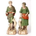 A LARGE PAIR OF MID 19TH CENTURY ROYAL DUX FIGURES OF A SHEPHERD AND SHEPHERDESS traditionally