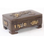 A MEIJI PERIOD JAPANESE PATINATED BRONZE LIDDED BOX with applied silver and gilt decoration