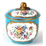 A 19TH CENTURY SERVES POT & COVER on pale blue ground with gilt decoration surrounding panels of