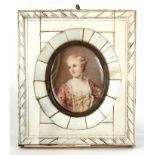 A 19th CENTURY MINIATURE PORTRAIT ON IVORY of a young woman with floral dress mounted in glazed