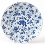 AN EARLY CHINESE KANGXI PERIOD BLUE AND WHITE PLATE decorated with flower sprays - six character