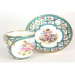 AN EARLY 19th CENTURY SERVES CUP AND SAUCER with flower and blue trellis decoration and painted