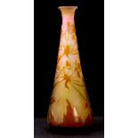 GALLE, A SMALL TAPERING CYLINDRICAL SHAPED MOULDED GLASS VASE with floral spray decoration on a Pink