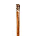 A LATE GEORGE III MALACCA BRASS MOUNTED SWORD STICK with twisted cast handle, having a triangular