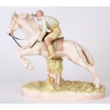 A LATE 19TH CENTURY ROYAL DUX PORCELAIN FIGURE OF A JUMPING RACE HORSE WITH JOCKEY - stamped and