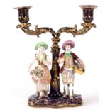 A 19TH CENTURY MINTON TWO BRANCH CANDELABRA on Royal blue ground with gilt decoration, supporting