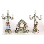 A LATE 19th CENTURY SCHIERHOLZ PORCELAIN CLOCK GARNITURE  with classical figures and applied rose