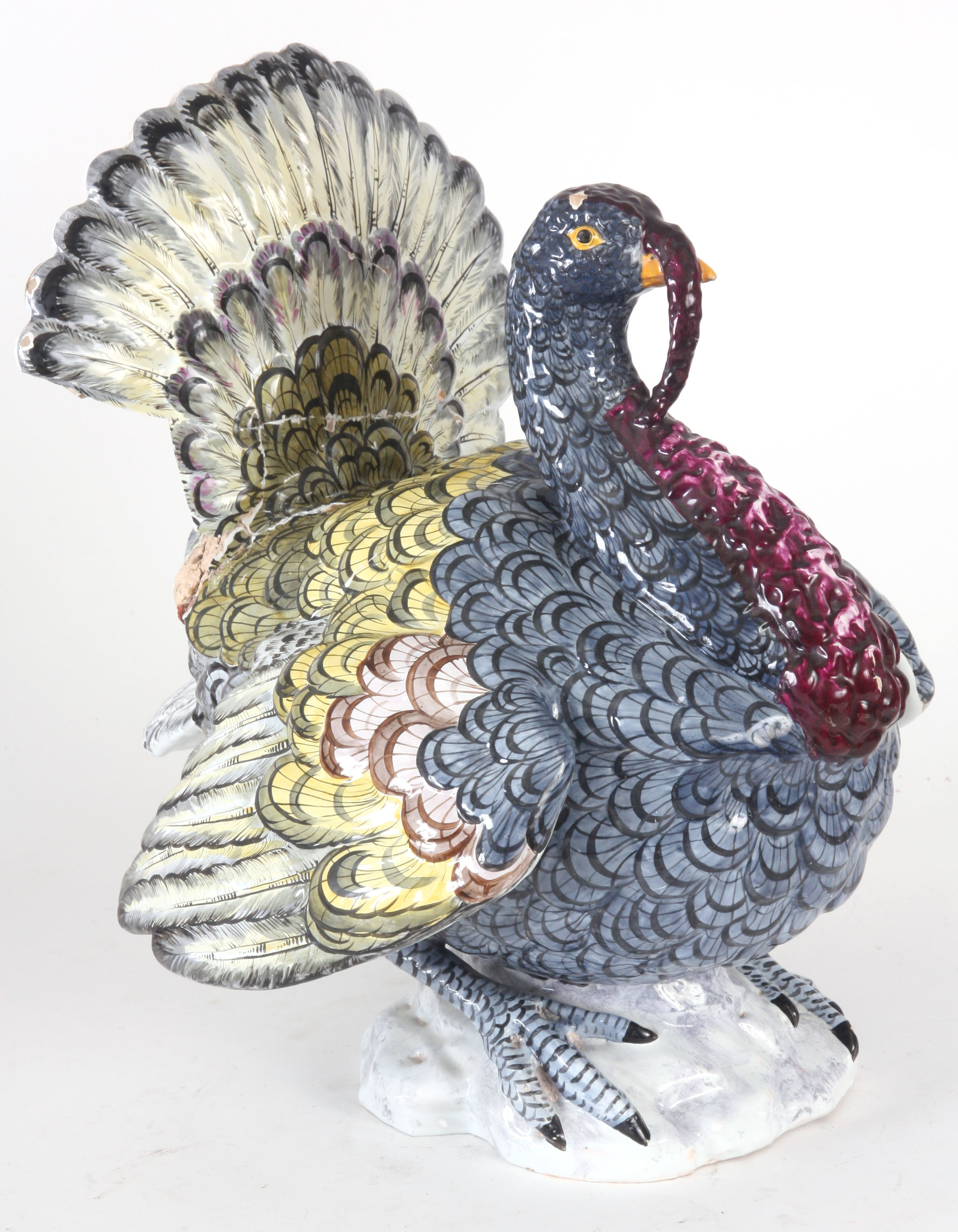 AN ANTIQUE FAIENCE POTTERY TIN-GLAZED EARTHENWARE MODEL OF A TURKEY with brightly coloured