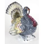 AN ANTIQUE FAIENCE POTTERY TIN-GLAZED EARTHENWARE MODEL OF A TURKEY with brightly coloured